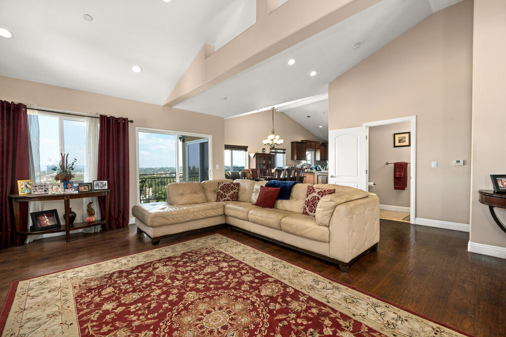 Daytime inside the homes family room and top floor with sweeping views of Northeast Los Angeles and the dining room and kitchen. Reach out for a tour of this El Sereno Hideaway Home For Sale