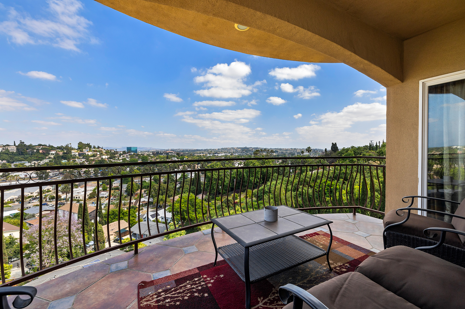 Daytime sweeping views of Northeast Los Angeles from the patio deck. El Sereno Hideaway Home For Sale