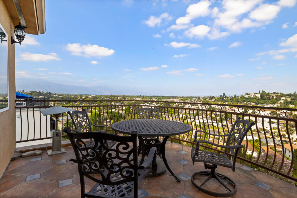 Outside on the balcony with wrought iron railing and panaromaic views El Sereno Hideaway Home For Sale