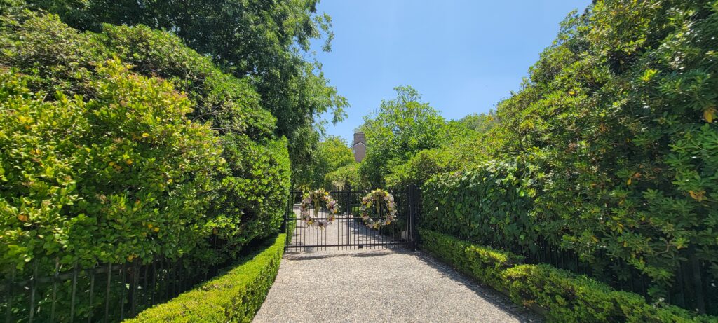 South Arroyo Estate with floral wreaths on the wrought iron gate. (Image courtesy of David Clark)