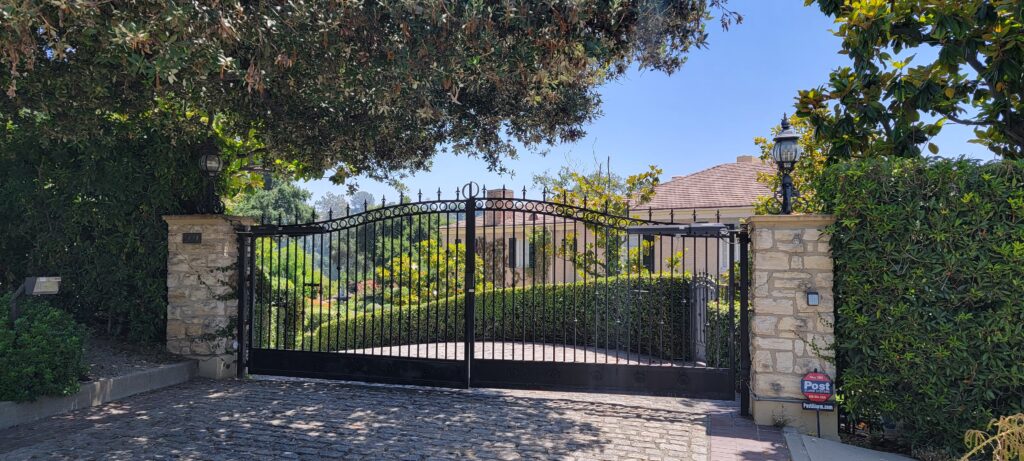 Outside a South Arroyo Pasadena Estate with cobblestone driveway and wrought iron gate entrance. (Image courtesy of David Clark)
