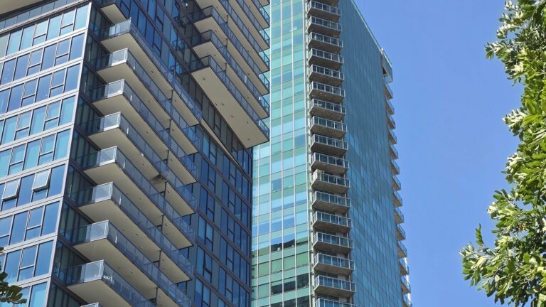Glass condo tower in Downtown Los Angeles. Before you make an offer, find out whether the building is warrantable or non-warrantable.