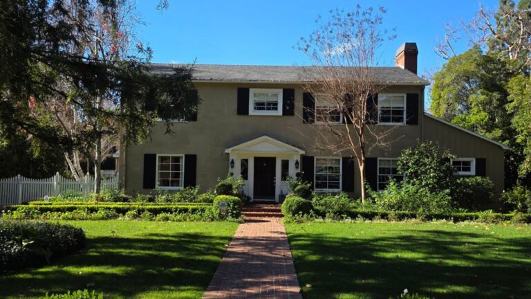 Brick colonial home with black shutters and a brick front walk in Los Angeles, illustrating the Los Angeles housing market in 2026
